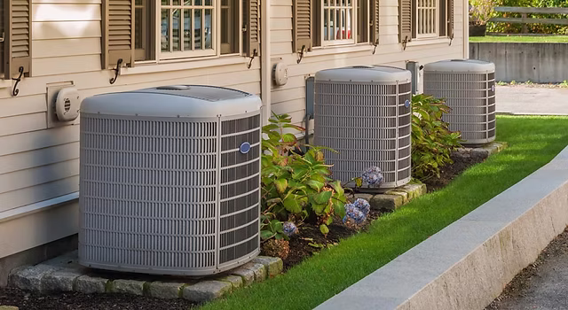 Heating and air conditioning inverter units installed on the side of a South Florida condo