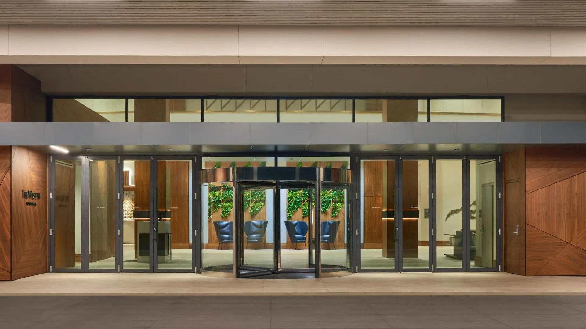 Glass impact entry doors at a commercial building storefront entrance