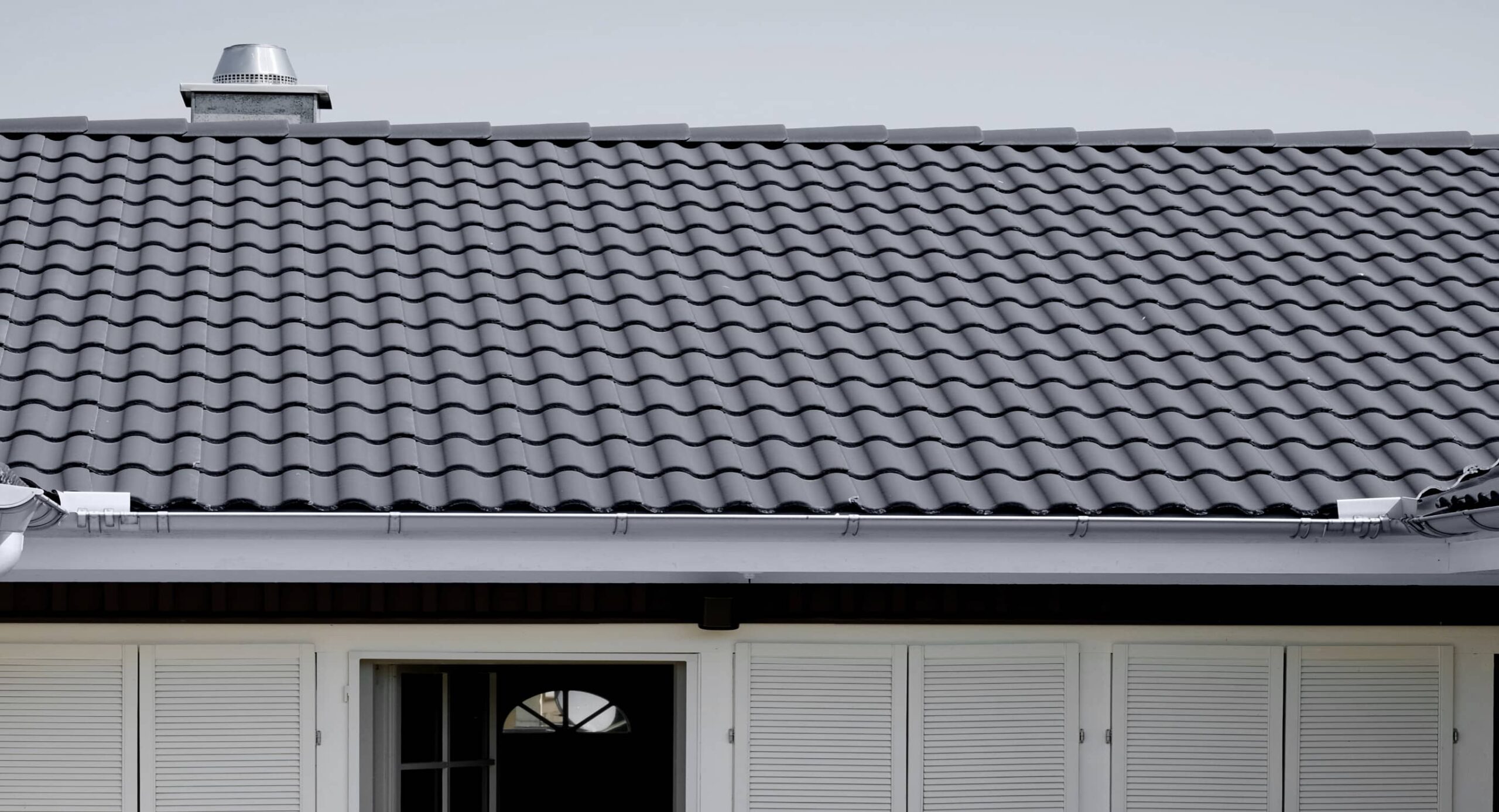 Close-up of a dark tile roof on a residential home